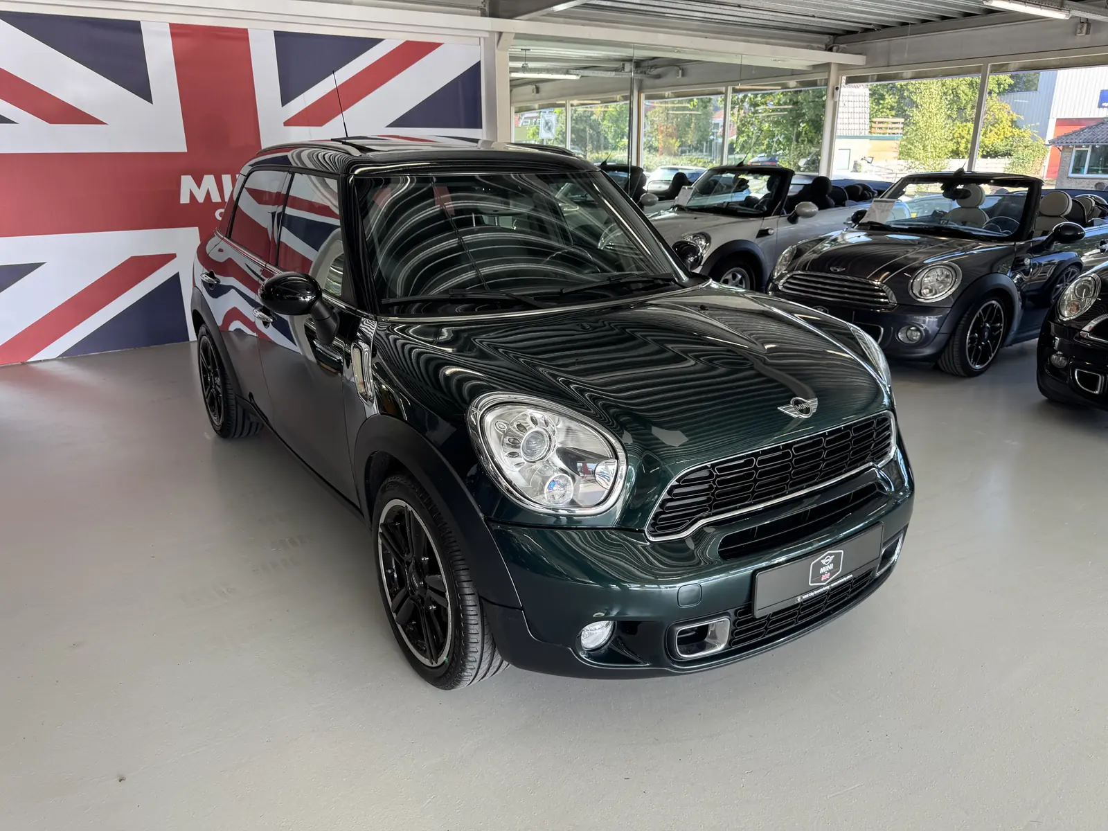 MINI Countryman 2011 in groen, driekwart voor