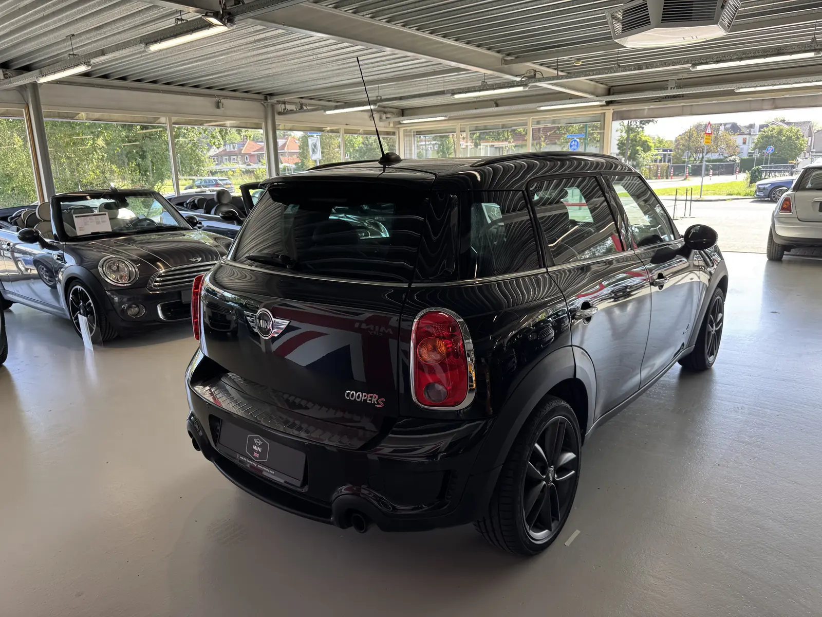 MINI Countryman S All4 2012 in zwart, driekwart achter